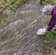 03-Lucy-Lippard-releasing-Ice-Book-into-Santa-Fe-River